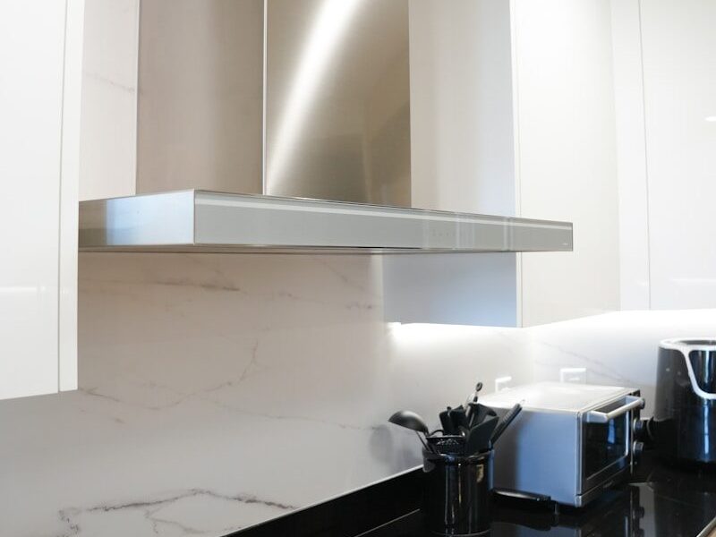 a stove top oven sitting inside of a kitchen